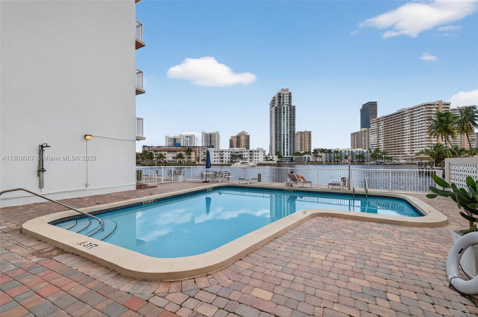121 Golden Isles Drive, Unit 205 Hallandale Beach, FL 33009 - Photo 59 of 82 a view of a swimming pool and a terrace