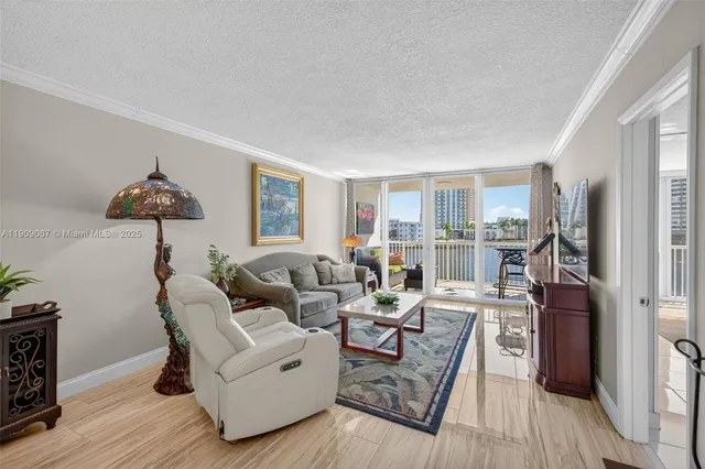 $425,000 | 121 Golden Isles Drive, Unit 205, Hallandale Beach, FL 33009