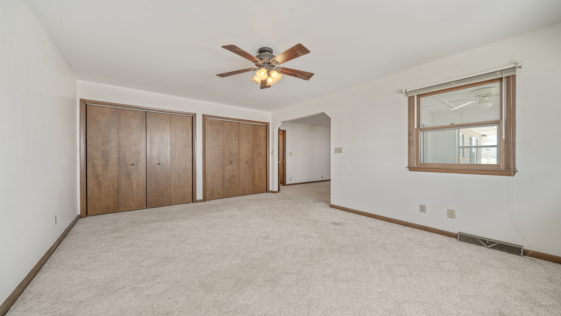 3621 East Brick Road Oregon, IL 61061 - Photo 10 of 29 a view of a livingroom with a ceiling fan and window