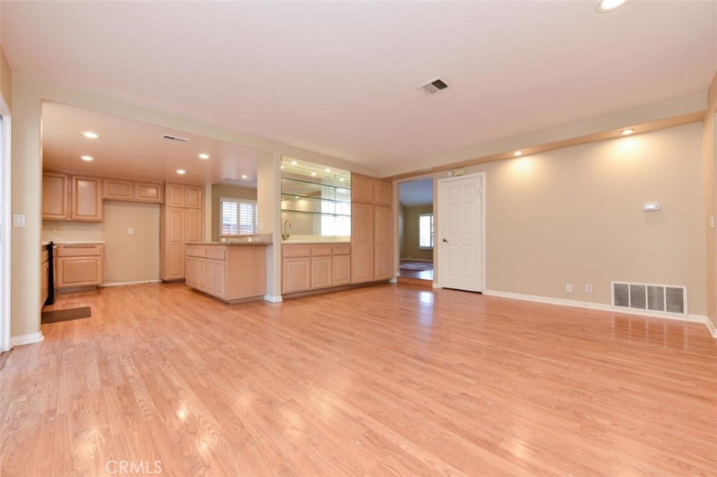 15052 Clemons Circle Irvine, CA 92604 - Photo 12 of 38 a view of an empty room with a window and kitchen view