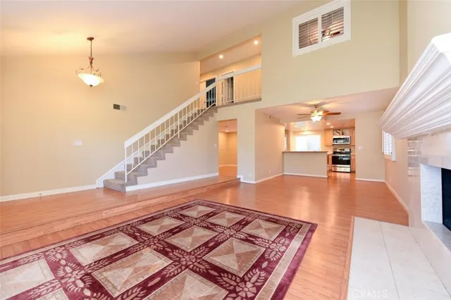 a view of kitchen and hall with wooden floor