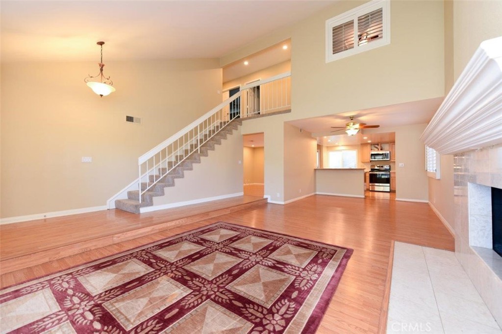 15052 Clemons Circle Irvine, CA 92604 - Photo 17 of 38 a view of kitchen and hall with wooden floor