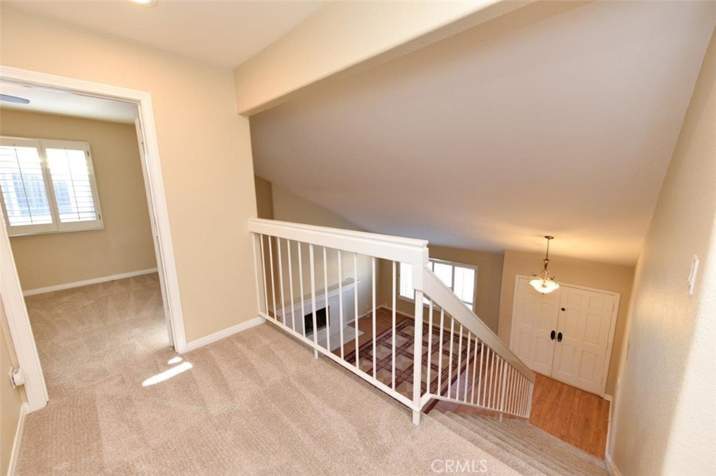 15052 Clemons Circle Irvine, CA 92604 - Photo 18 of 38 a view of a hallway with staircase