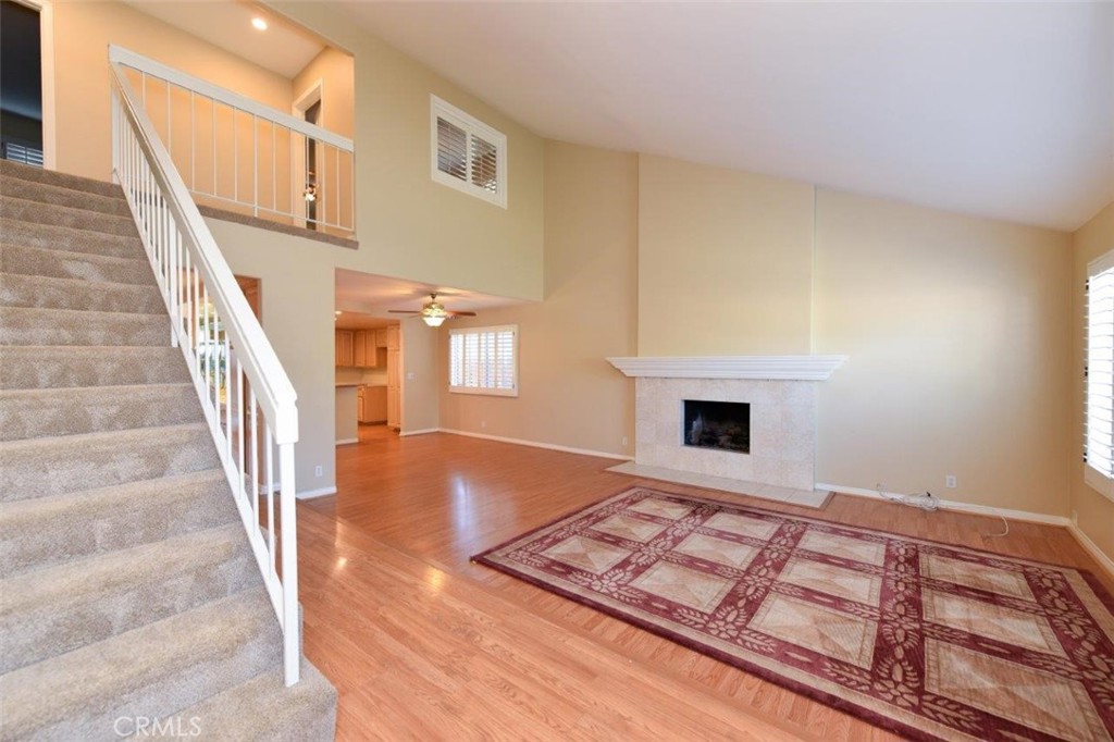 15052 Clemons Circle Irvine, CA 92604 - Photo 3 of 38 a view of an empty room with window and fireplace