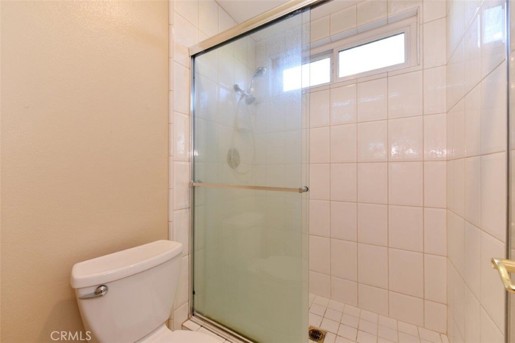 15052 Clemons Circle Irvine, CA 92604 - Photo 32 of 38 a white toilet sitting next to a bathroom sink