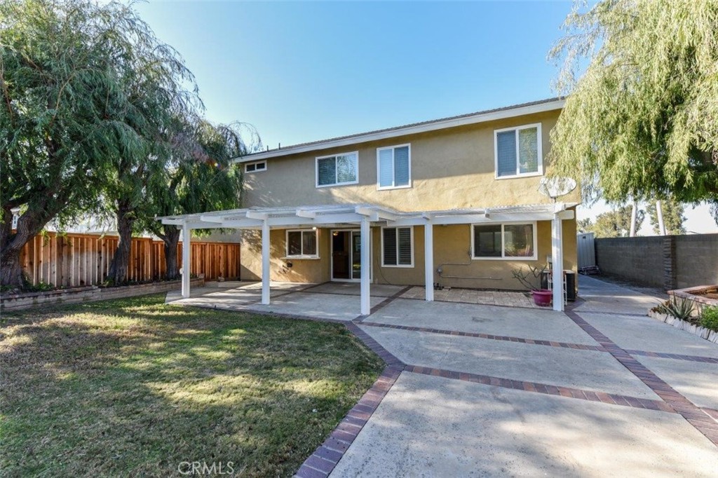 15052 Clemons Circle Irvine, CA 92604 - Photo 37 of 38 a view of a house with a yard and a large tree