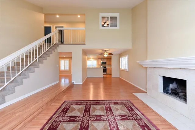a view of a living room with a fireplace