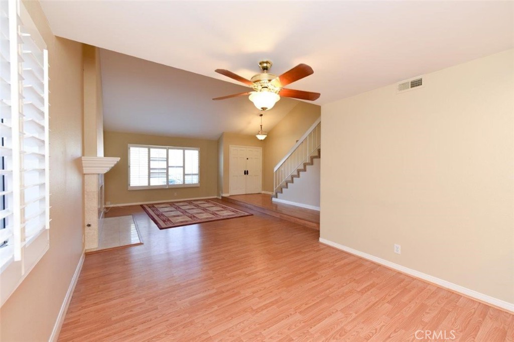 15052 Clemons Circle Irvine, CA 92604 - Photo 6 of 38 a view of an empty room with window and wooden floor