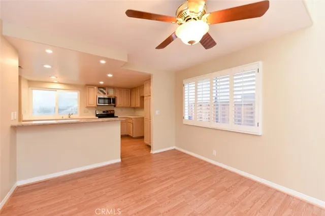 a view of kitchen with granite countertop cabinets and outdoor space
