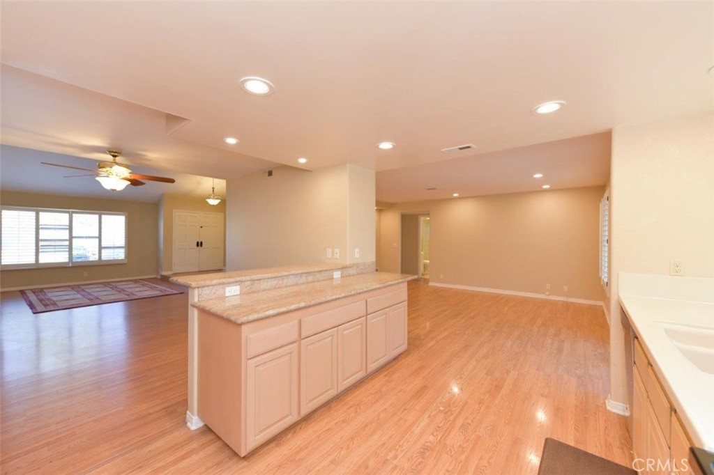 15052 Clemons Circle Irvine, CA 92604 - Photo 10 of 38 a spacious bathroom with a granite countertop sink a large mirror and a shower