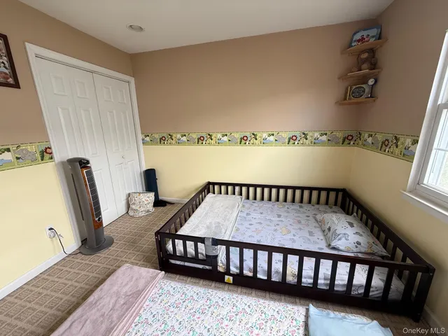 a bedroom with furniture and a window