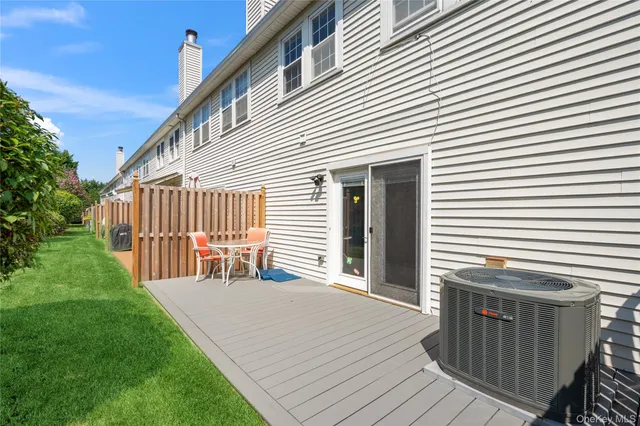 a view of a house with wooden deck