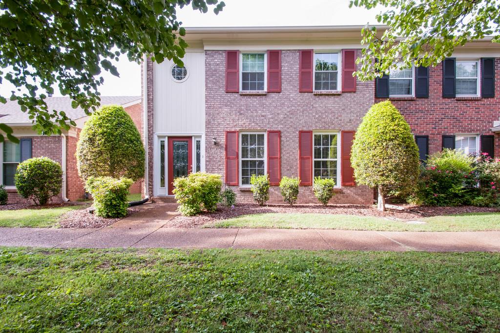 1101 General George Patton Road, Unit 1101 Nashville, TN 37221 - Photo 1 of 30 a view of a house with a yard and large tree