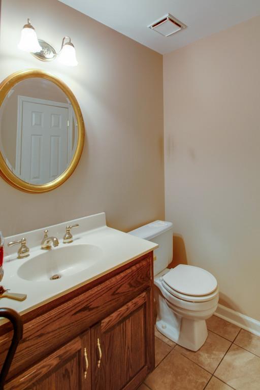 1101 General George Patton Road, Unit 1101 Nashville, TN 37221 - Photo 15 of 30 a bathroom with a sink a toilet and a mirror