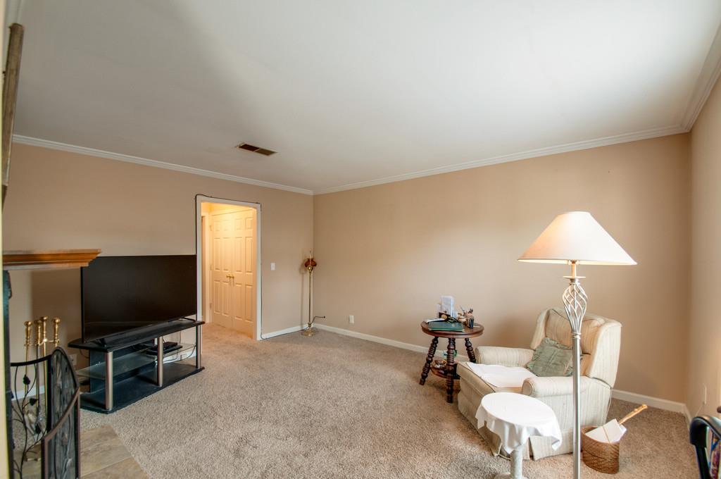 1101 General George Patton Road, Unit 1101 Nashville, TN 37221 - Photo 16 of 30 a living room with furniture and a flat screen tv