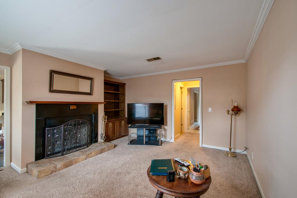 1101 General George Patton Road, Unit 1101 Nashville, TN 37221 - Photo 18 of 30 a living room with furniture and a fireplace