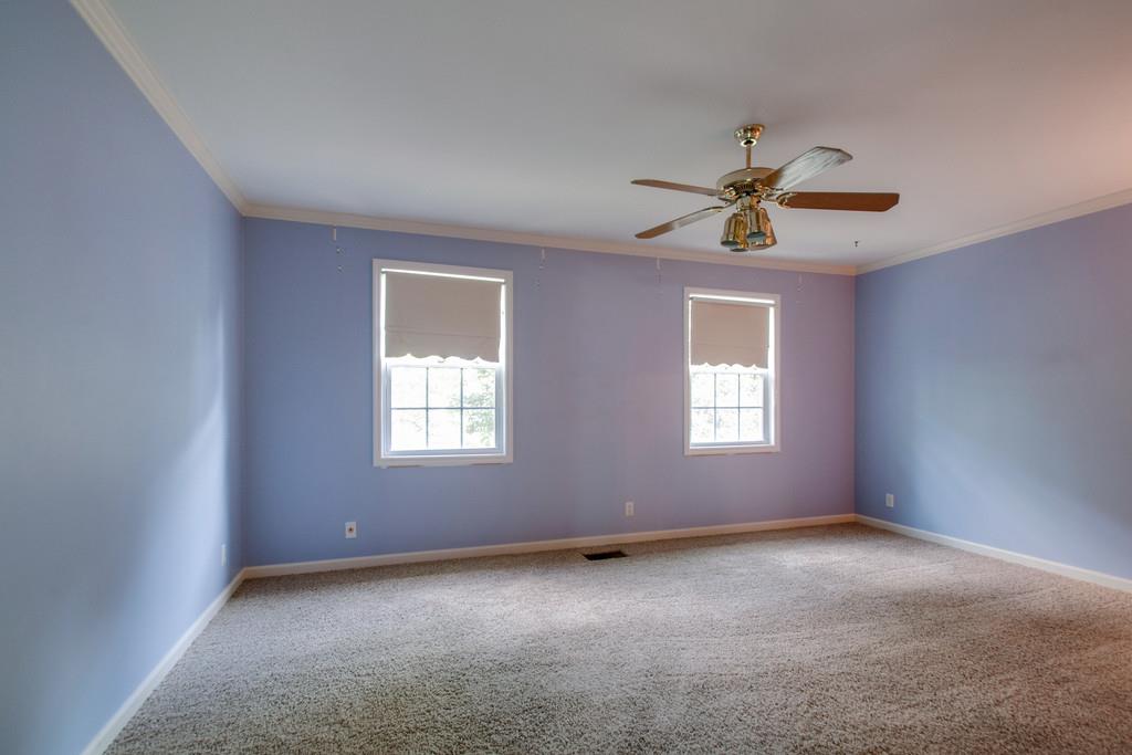1101 General George Patton Road, Unit 1101 Nashville, TN 37221 - Photo 22 of 30 an empty room with a window and a fan