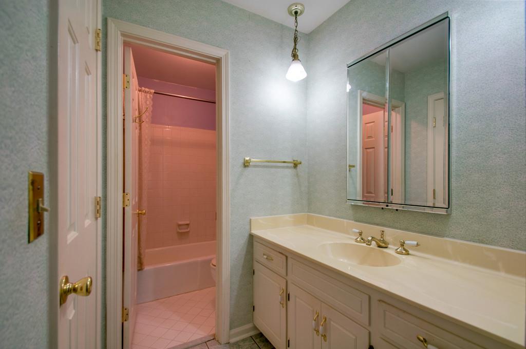 1101 General George Patton Road, Unit 1101 Nashville, TN 37221 - Photo 23 of 30 a bathroom with a sink and a mirror
