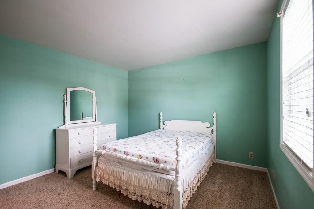 1101 General George Patton Road, Unit 1101 Nashville, TN 37221 - Photo 24 of 30 a bedroom with a bed and window