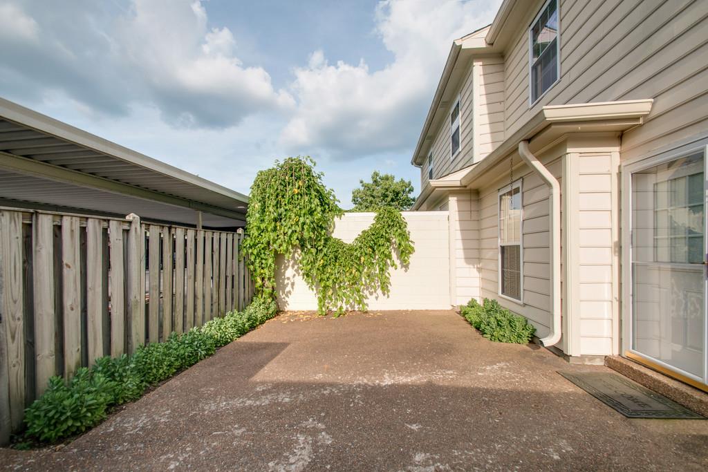 1101 General George Patton Road, Unit 1101 Nashville, TN 37221 - Photo 26 of 30 a front view of a house having yard
