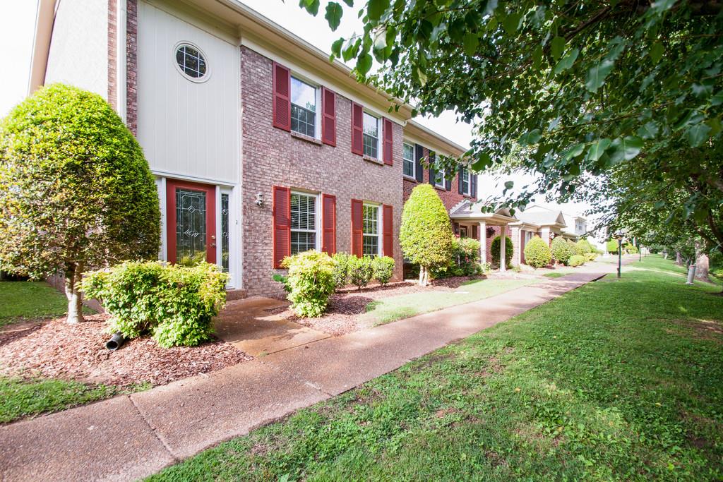 1101 General George Patton Road, Unit 1101 Nashville, TN 37221 - Photo 3 of 30 a front view of a house with garden