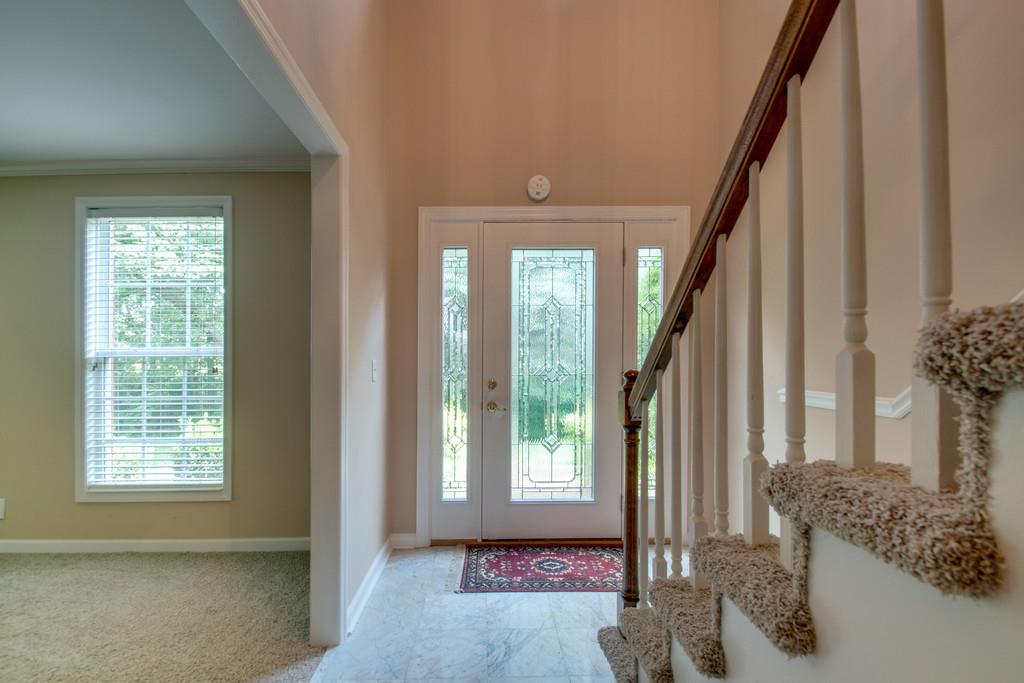 1101 General George Patton Road, Unit 1101 Nashville, TN 37221 - Photo 5 of 30 a view of an entryway with wooden floor and windows