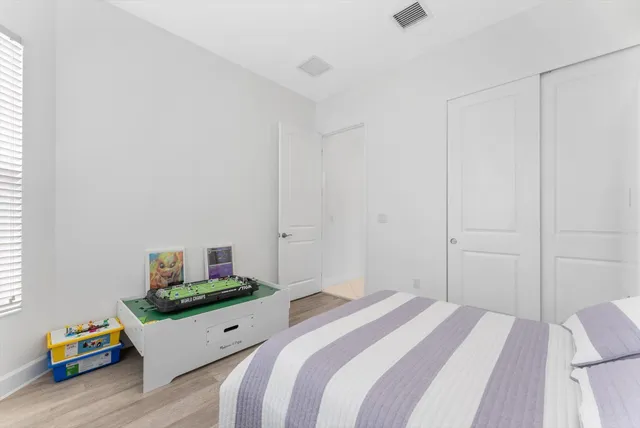 a bathroom with a double vanity sink toilet and shower