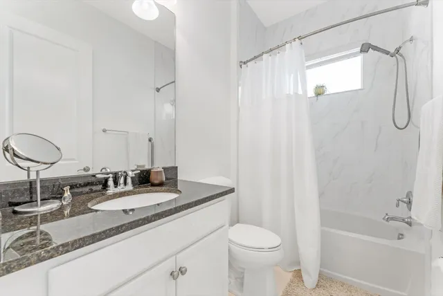 a bedroom with a bed and a table in it