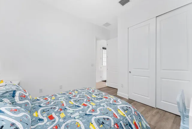 a utility room with fridge dryer and baby on it