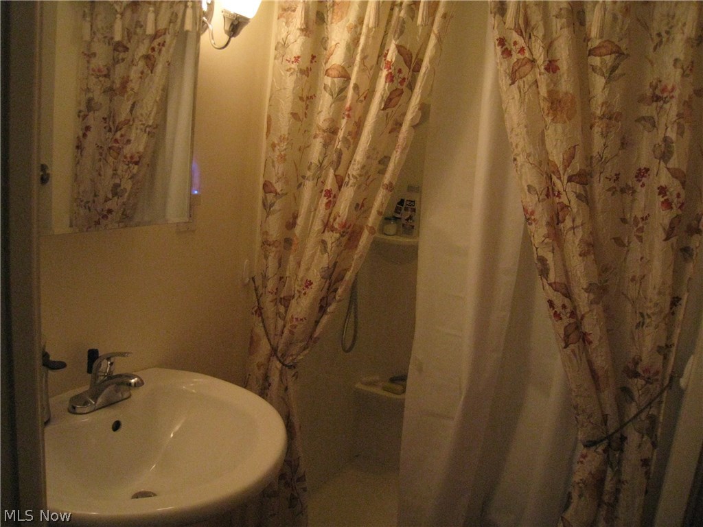 8087 Munson Road Mentor, OH 44060 - Photo 18 of 23 Full bath with walk in shower off the family room, new in 2012.
