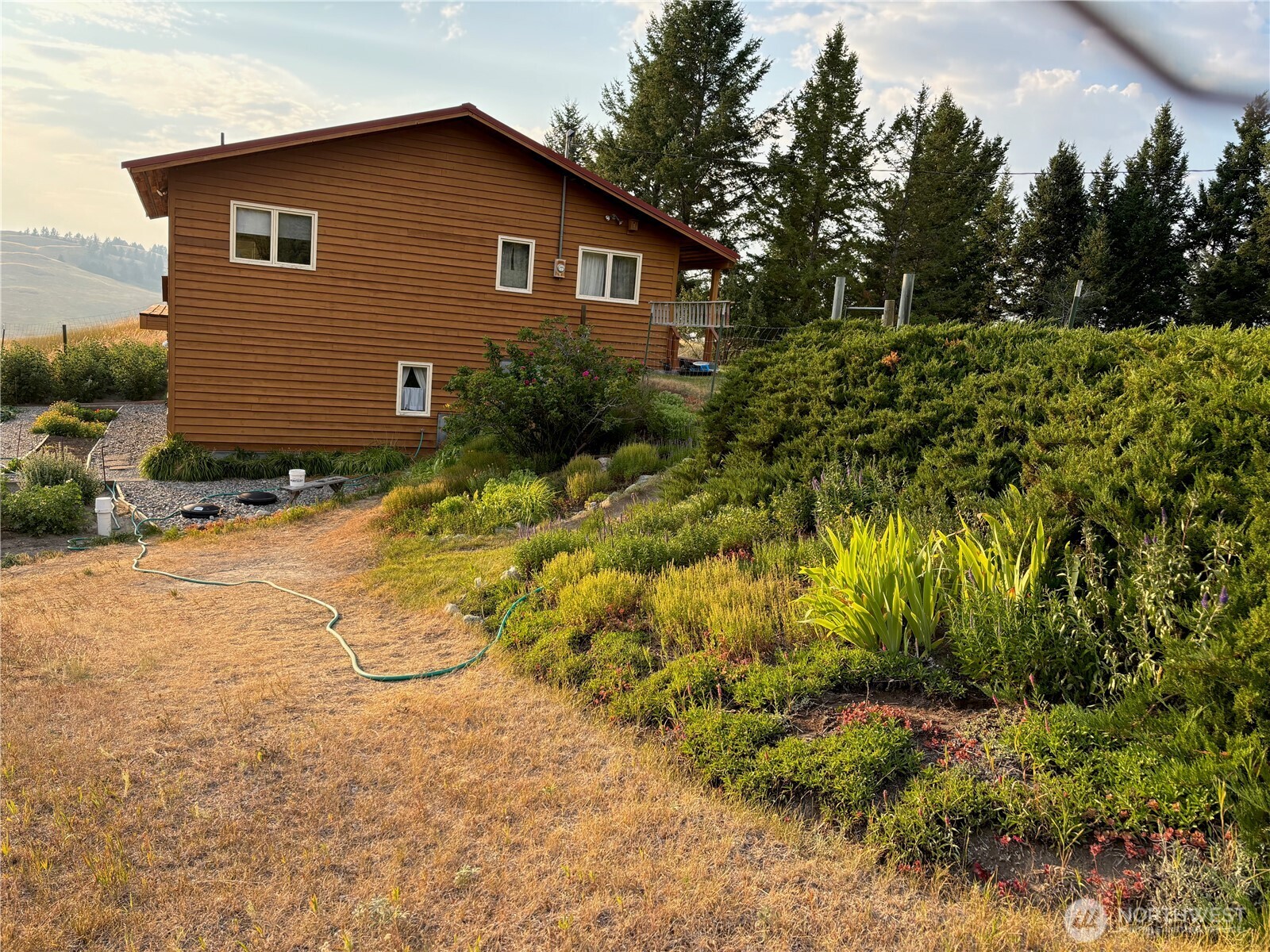 40 Turner Homestead Road Oroville, WA 98844 - Photo 9 of 27 a view of a house with a yard and trees