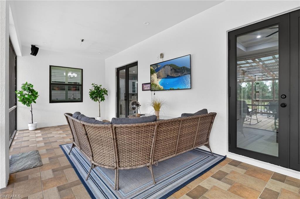 2642 10th Avenue Northeast Naples, FL 34120 - Photo 32 of 38 a living room with furniture