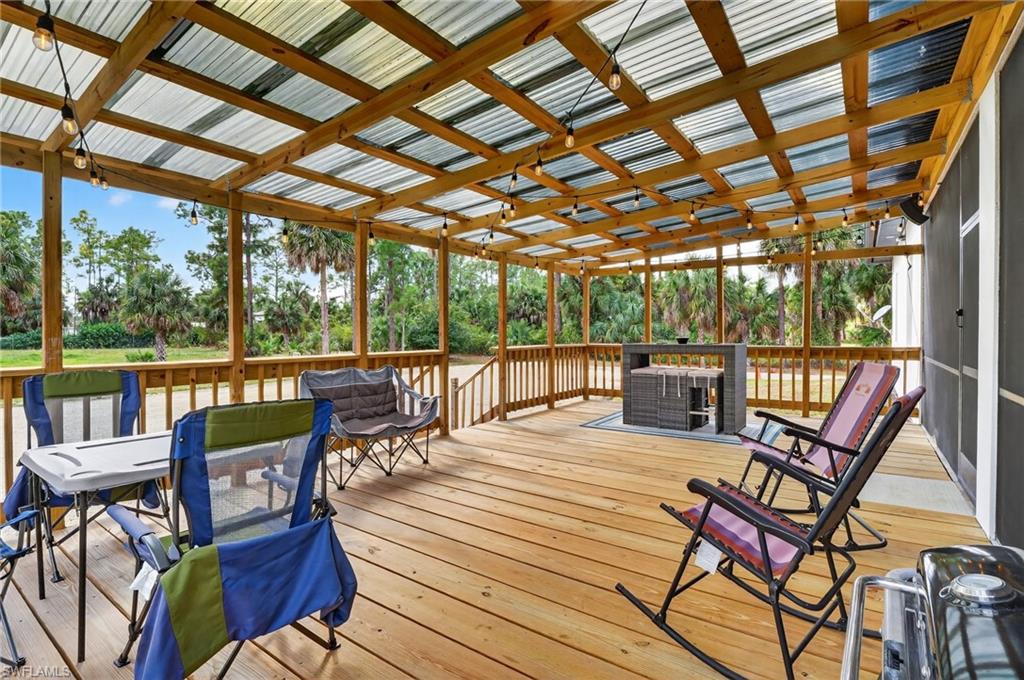 2642 10th Avenue Northeast Naples, FL 34120 - Photo 34 of 38 a view of a patio with wooden floor
