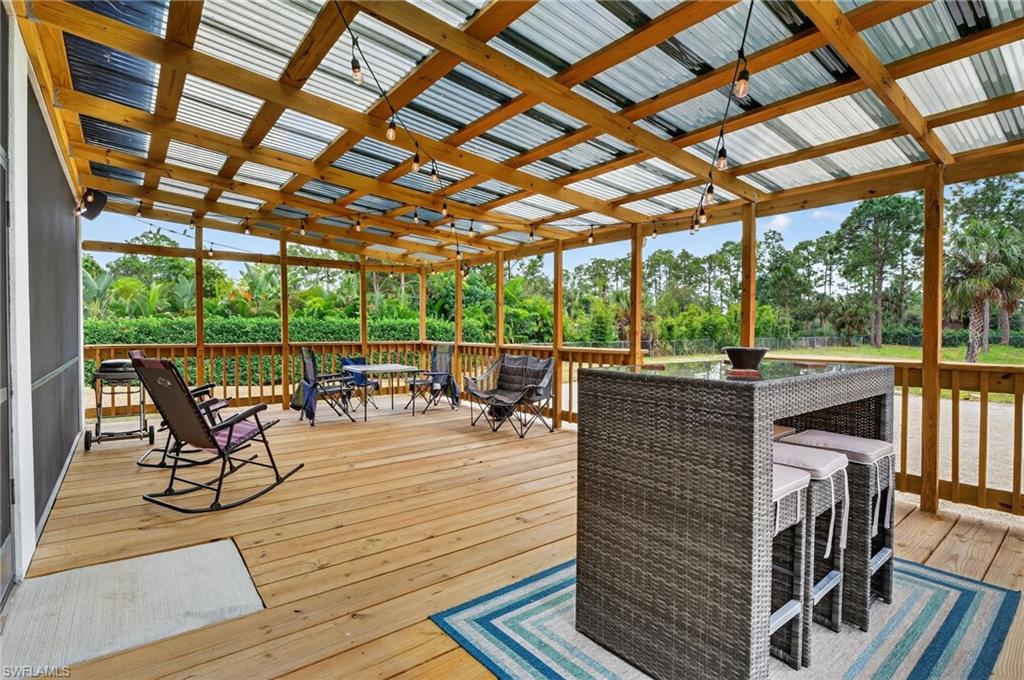 2642 10th Avenue Northeast Naples, FL 34120 - Photo 35 of 38 a view of a patio with wooden floor
