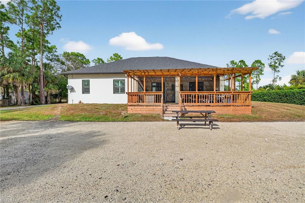 2642 10th Avenue Northeast Naples, FL 34120 - Photo 37 of 38 a house with palm tree in front of it