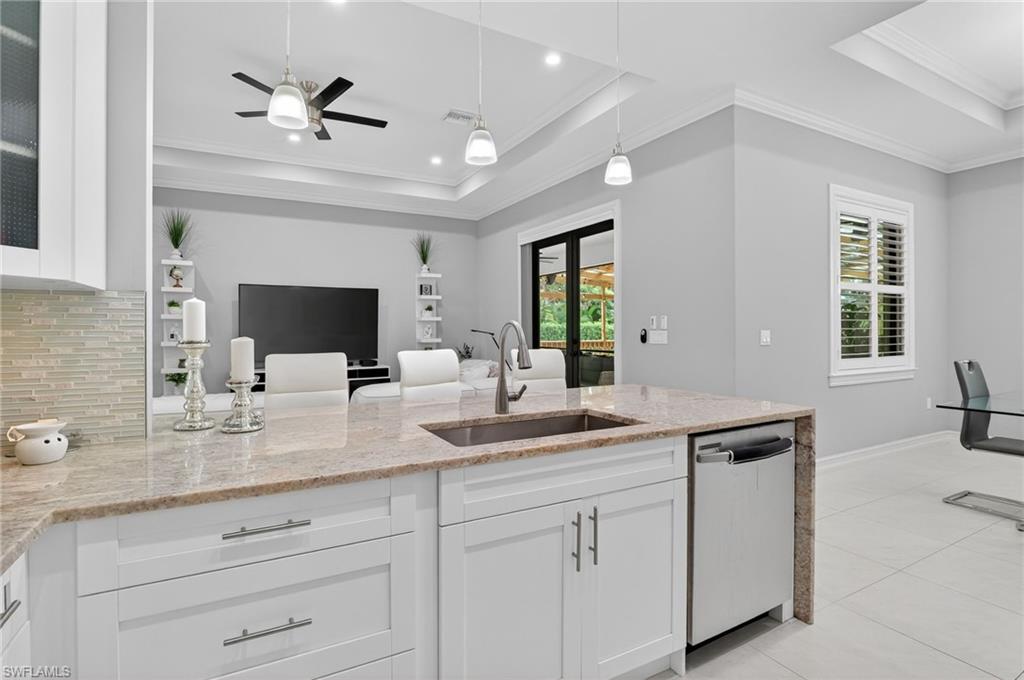 2642 10th Avenue Northeast Naples, FL 34120 - Photo 9 of 38 a bathroom with a sink double vanity and a mirror