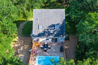an aerial view of a house with outdoor space garden and seating area
