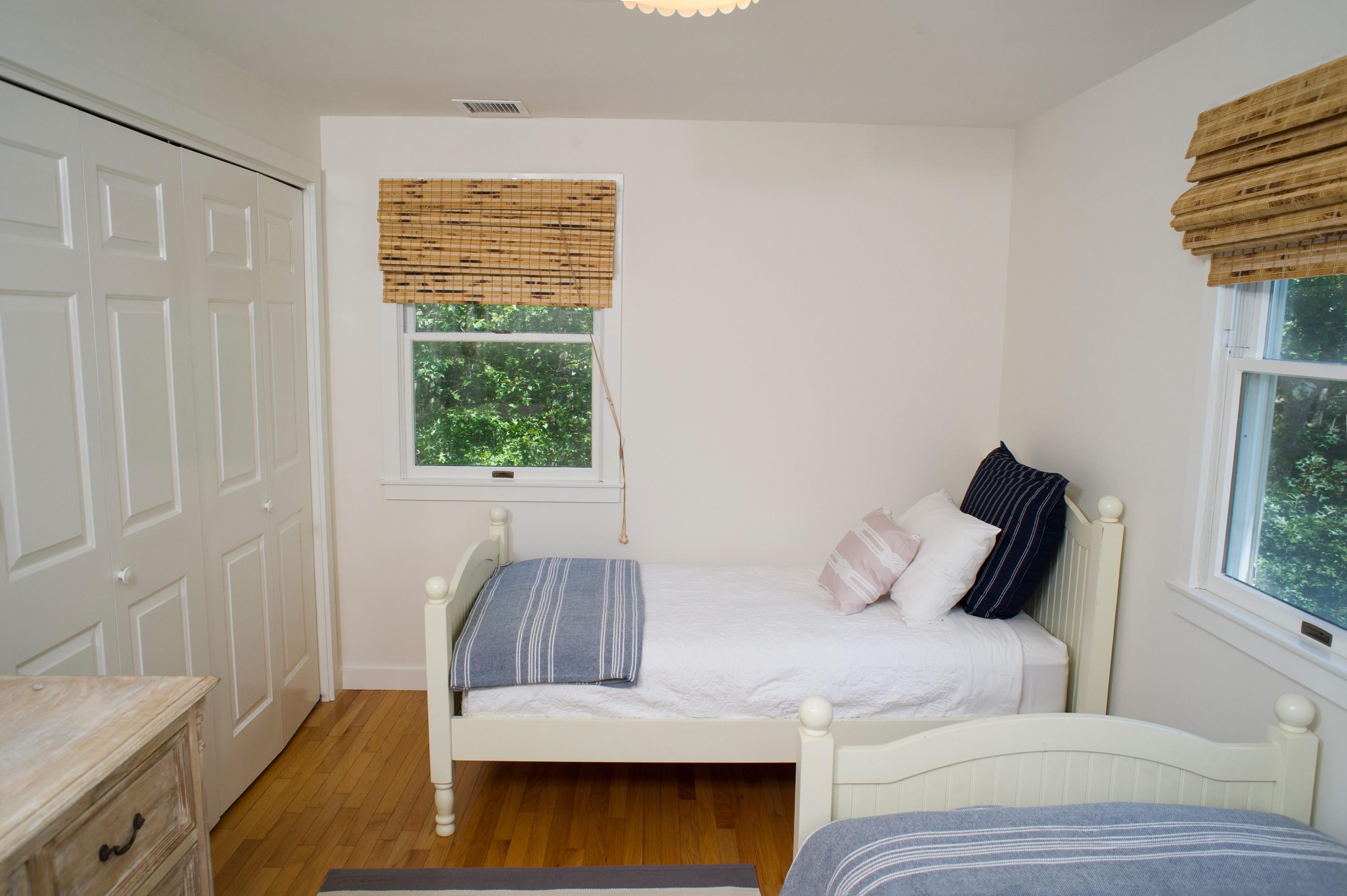 51 Old Purchase Road Edgartown, MA 02539 - Photo 13 of 24 a bedroom with a bed and wooden floor