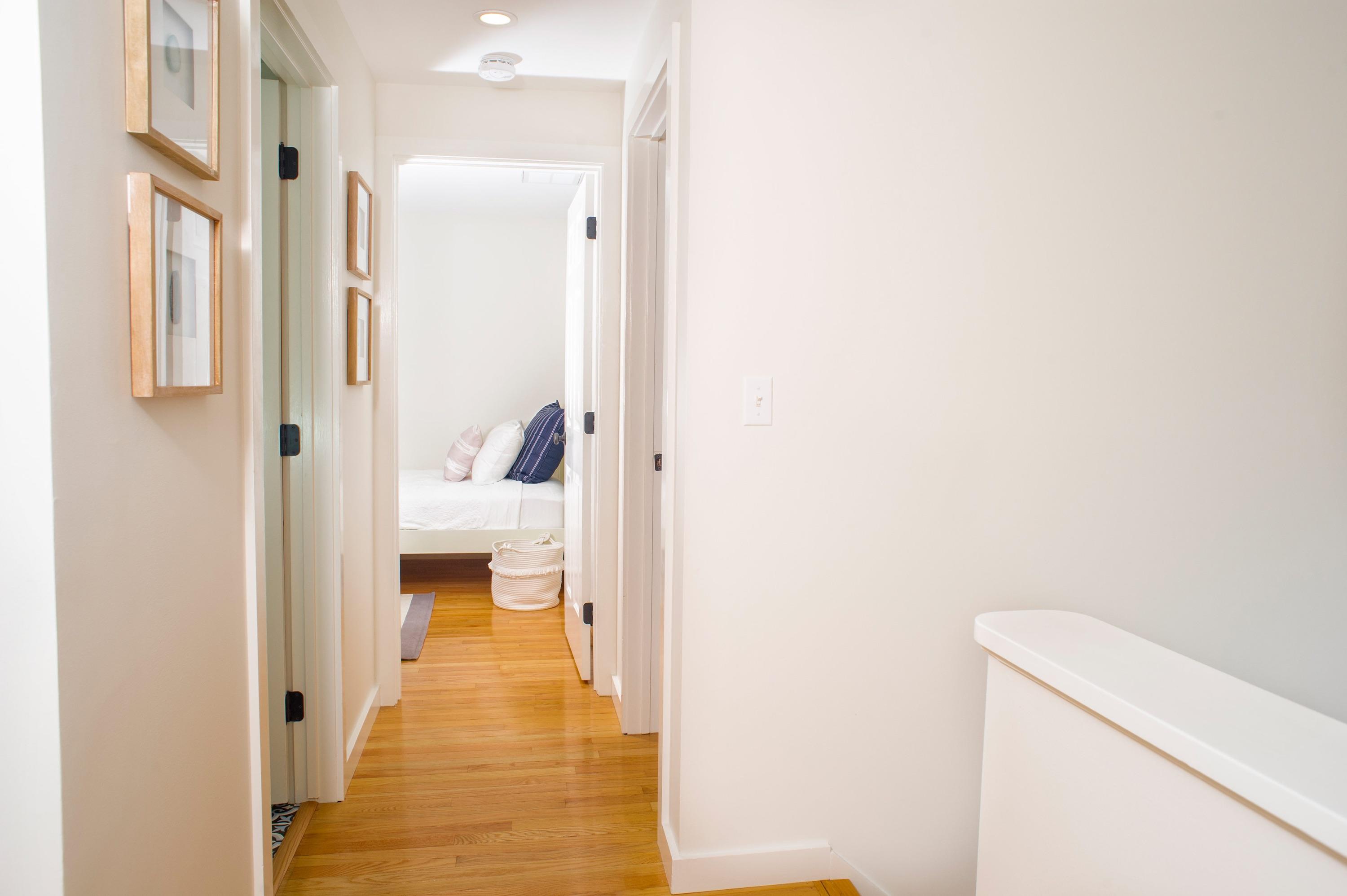 51 Old Purchase Road Edgartown, MA 02539 - Photo 15 of 24 a view of a hallway with wooden floor and a bathroom