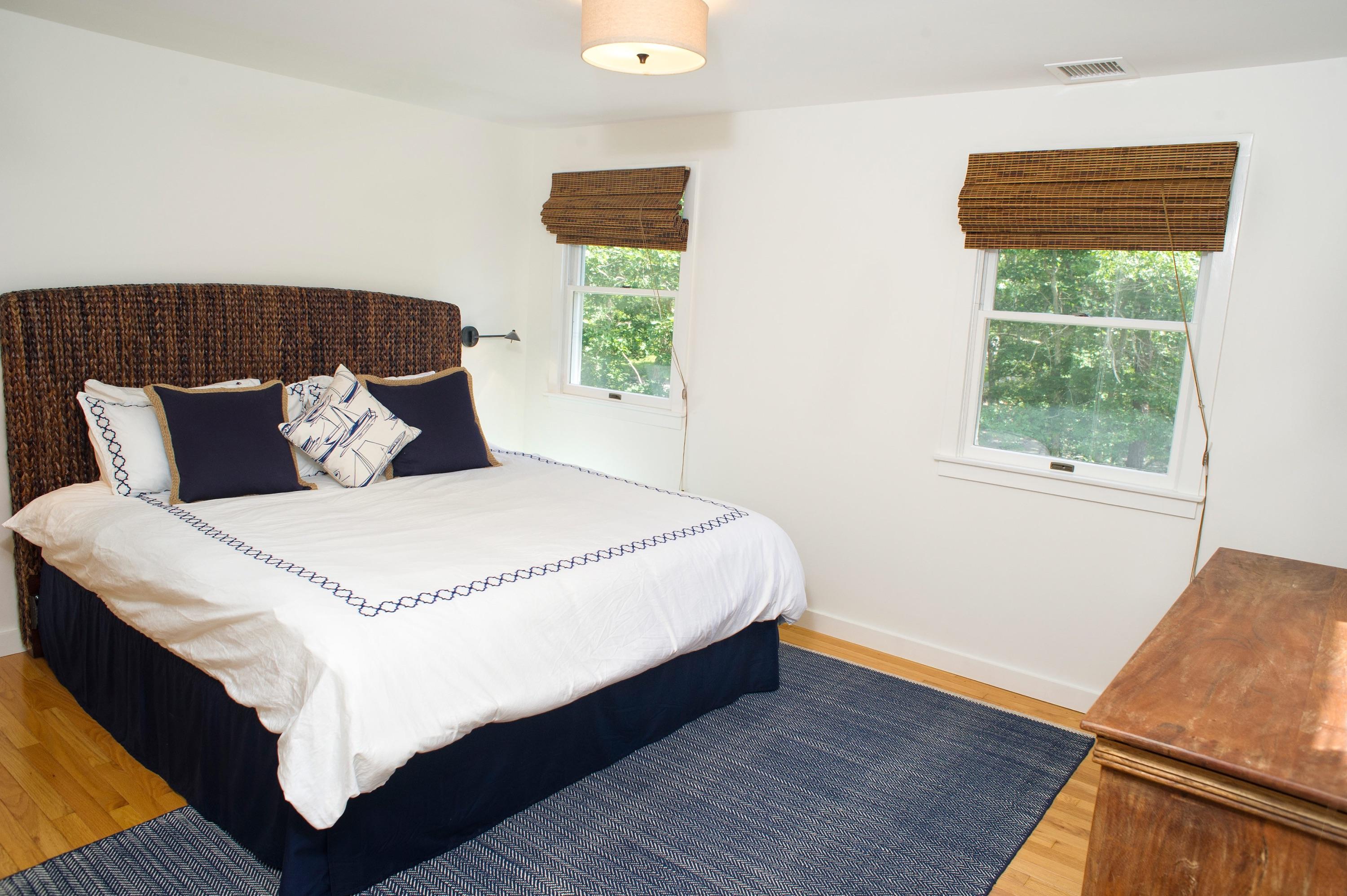 51 Old Purchase Road Edgartown, MA 02539 - Photo 16 of 24 a large bed sitting in a bedroom next to a window