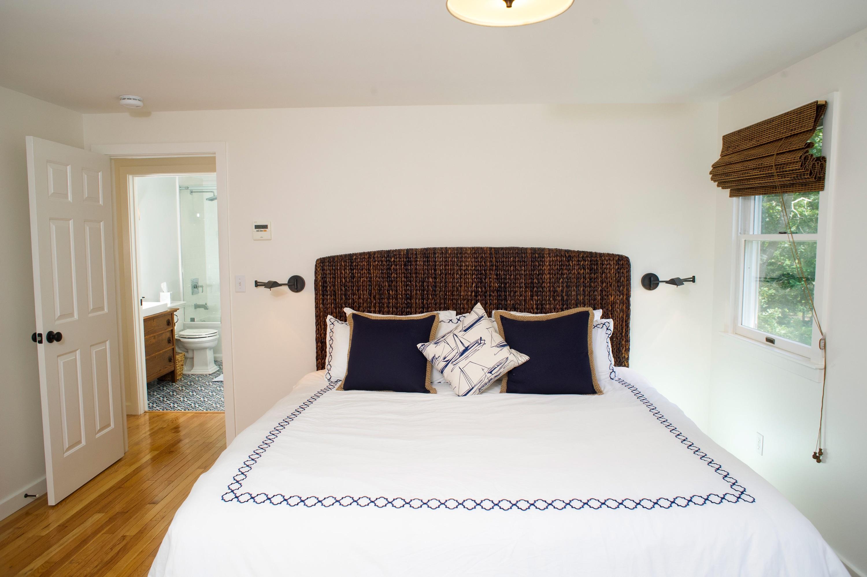 51 Old Purchase Road Edgartown, MA 02539 - Photo 17 of 24 a large bed sitting in a bedroom next to a window