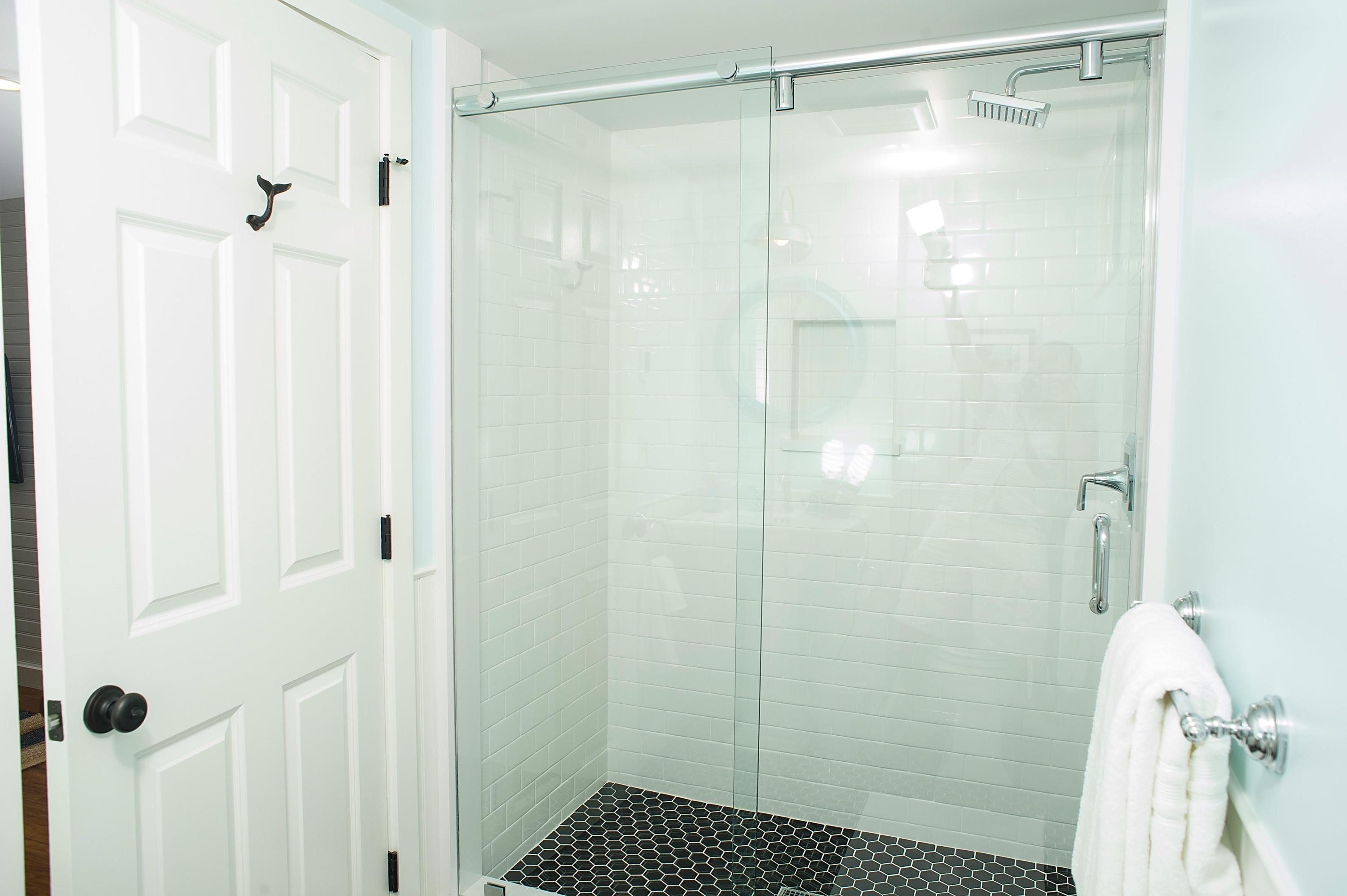 51 Old Purchase Road Edgartown, MA 02539 - Photo 20 of 24 a bathroom with a shower and a glass door