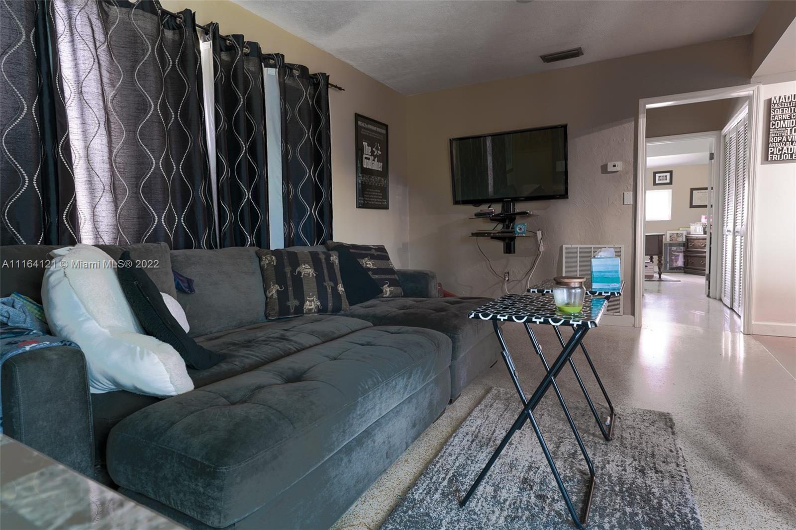 Cooper Colony Estates Cooper City, FL 33328 - Photo 14 of 33 a living room with furniture and a flat screen tv