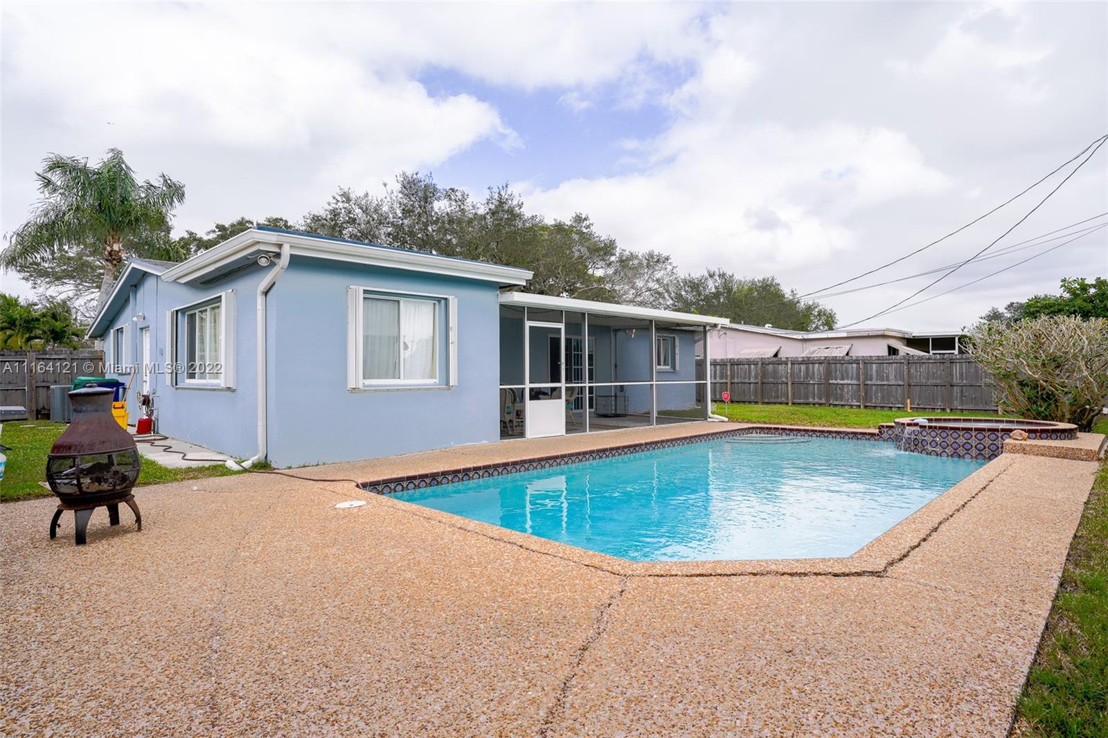 Cooper Colony Estates Cooper City, FL 33328 - Photo 20 of 33 a view of a house with swimming pool and sitting area