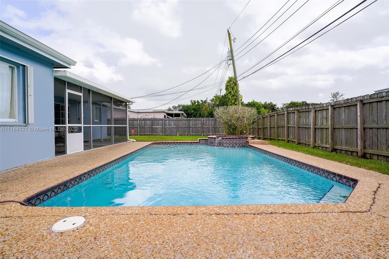 Cooper Colony Estates Cooper City, FL 33328 - Photo 21 of 33 a view of a swimming pool with a patio