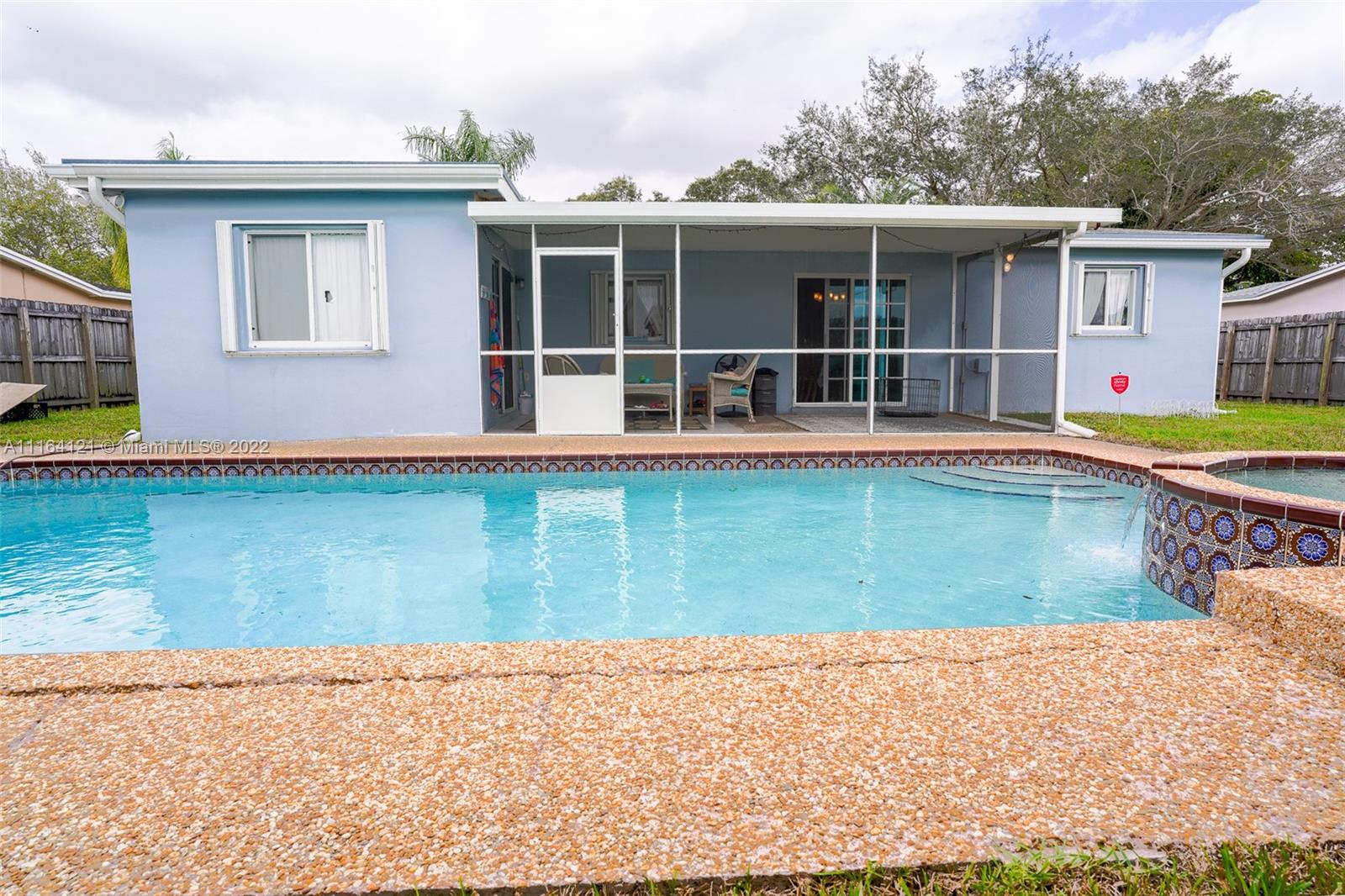 Cooper Colony Estates Cooper City, FL 33328 - Photo 23 of 33 a view of a house with pool and a yard