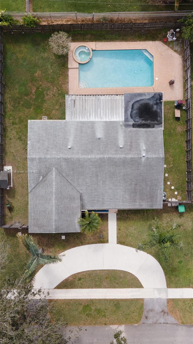 Cooper Colony Estates Cooper City, FL 33328 - Photo 28 of 33 an aerial view of a house with a yard and a lake view