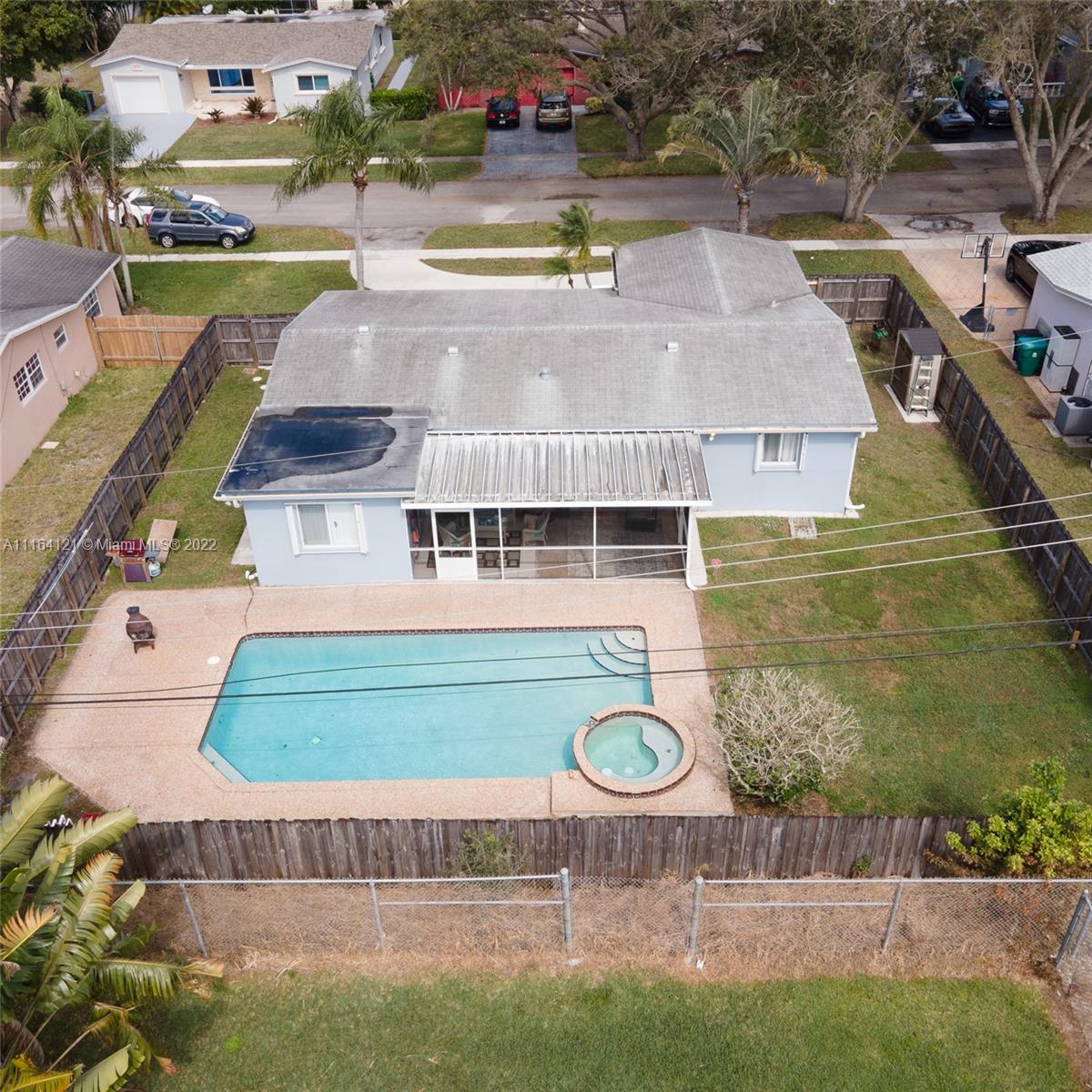Cooper Colony Estates Cooper City, FL 33328 - Photo 30 of 33 an aerial view of a house with swimming pool and outdoor seating