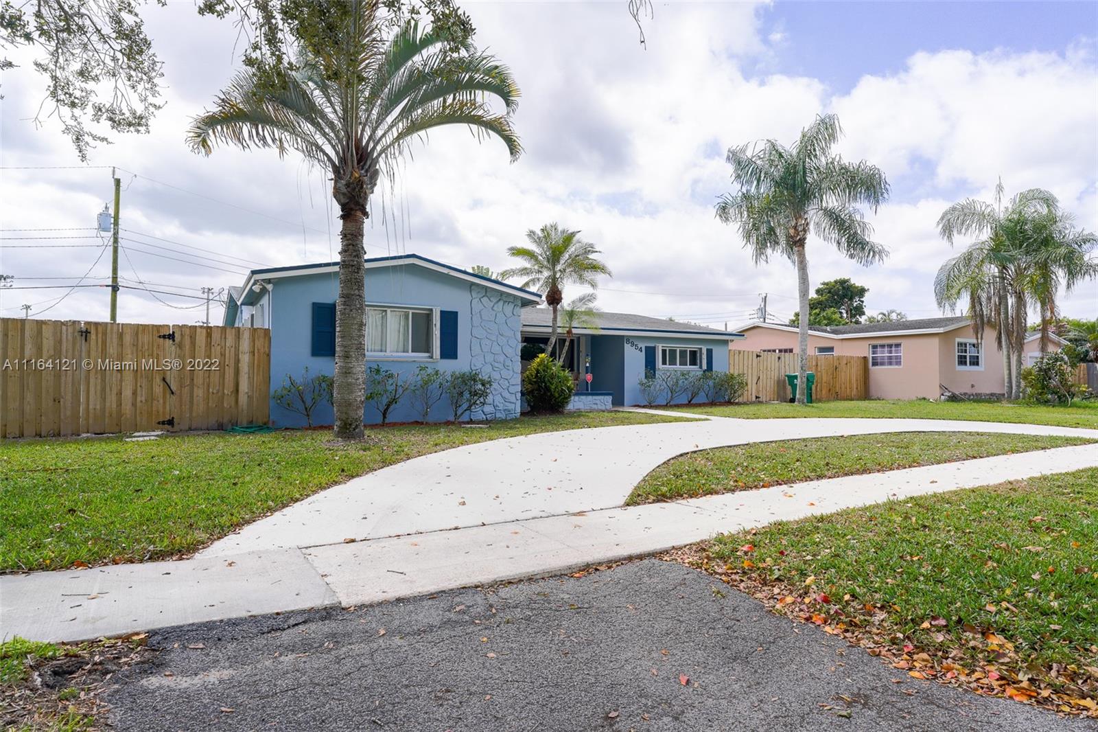 Cooper Colony Estates Cooper City, FL 33328 - Photo 3 of 33 a front view of house with yard and green space