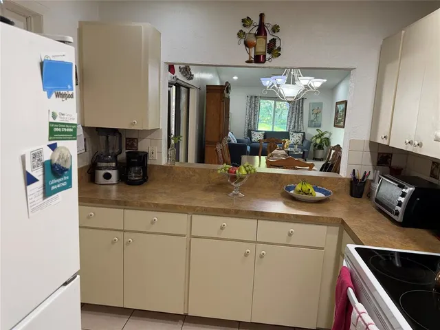 a kitchen with sink cabinets and window